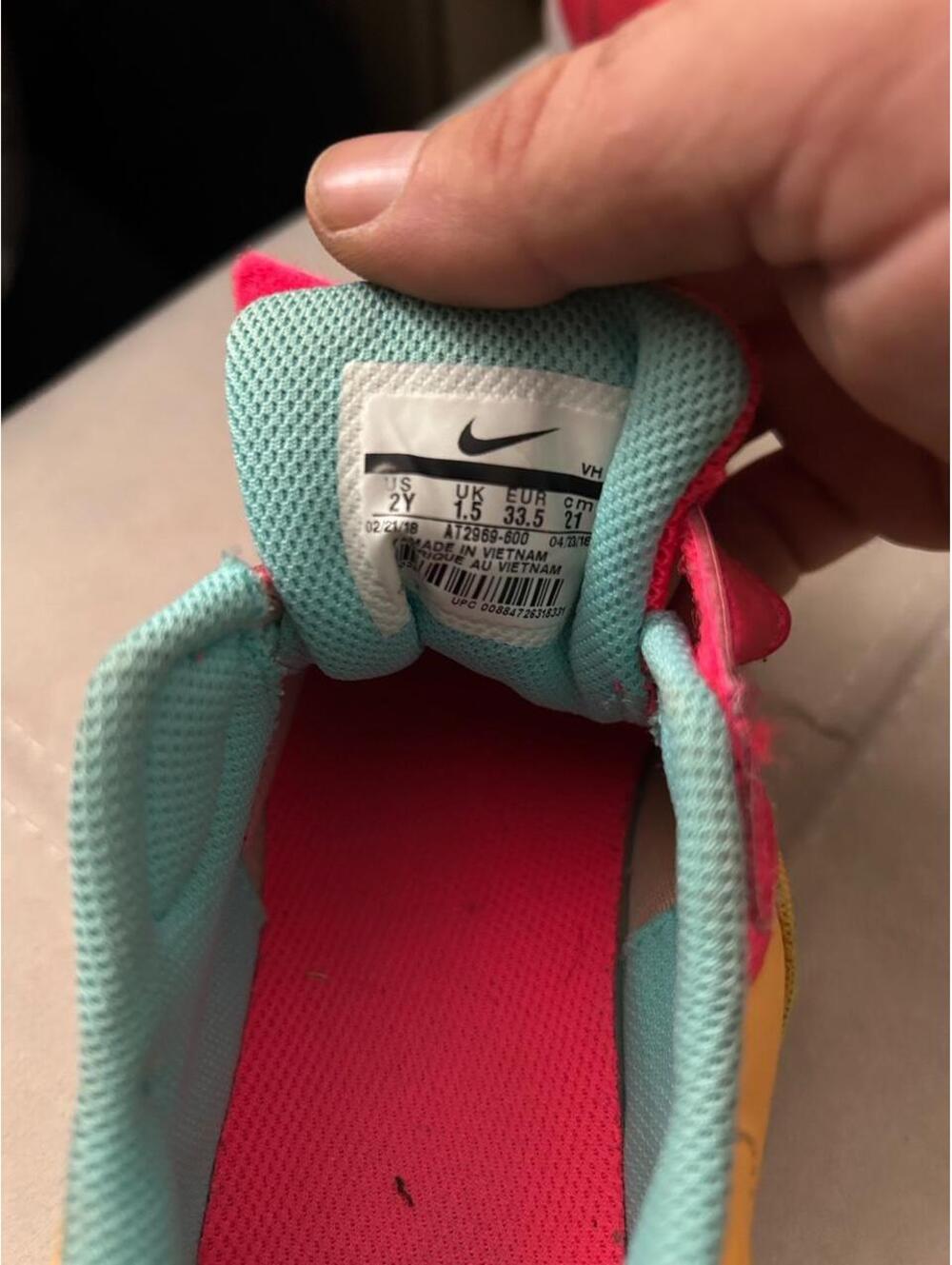 Nike kids sneakers in red, yellow, and teal with a teal Nike swoosh, size US 2 - Picture 6 of 7